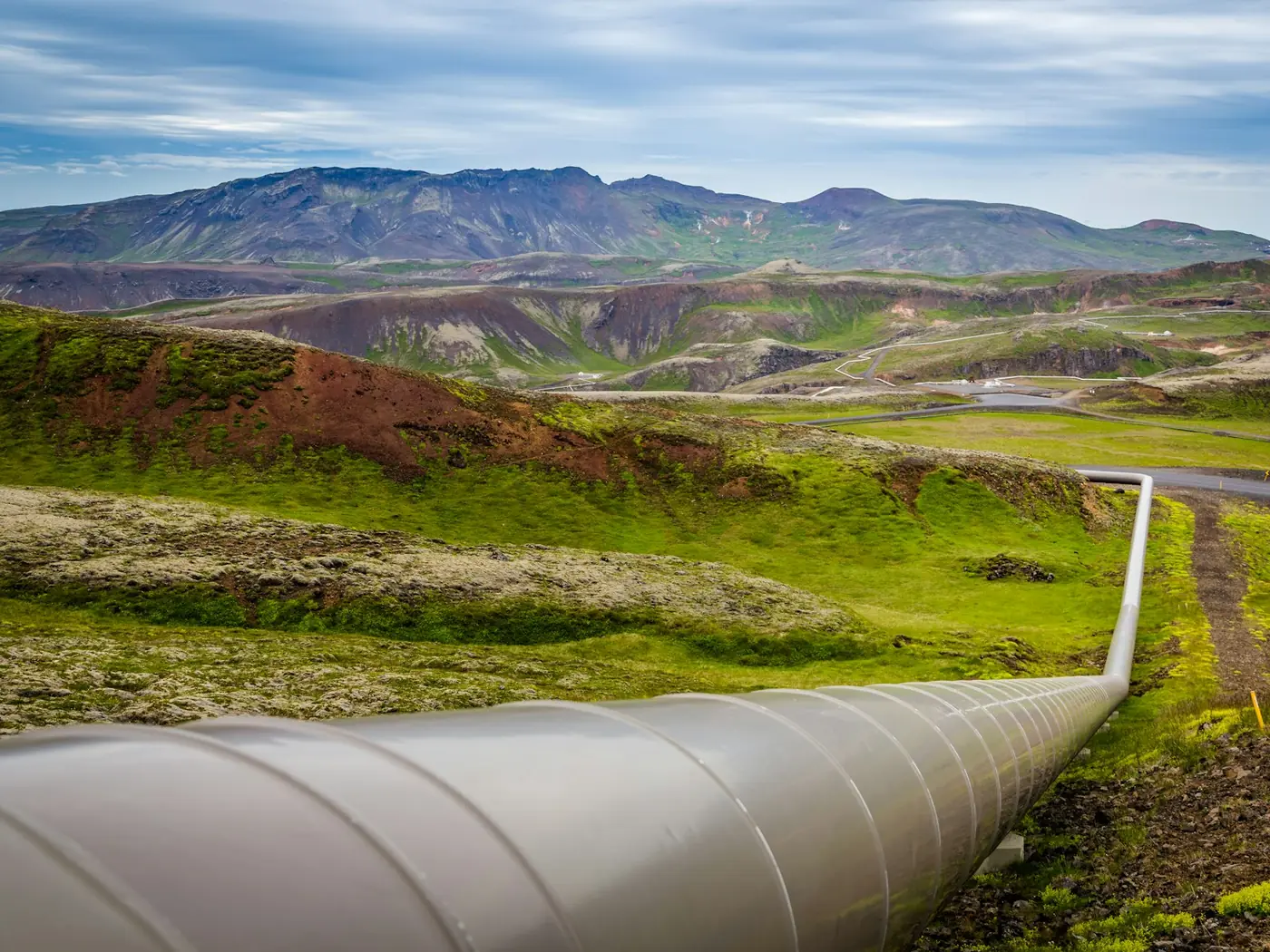 A large-diameter gas pipeline crossing open green country