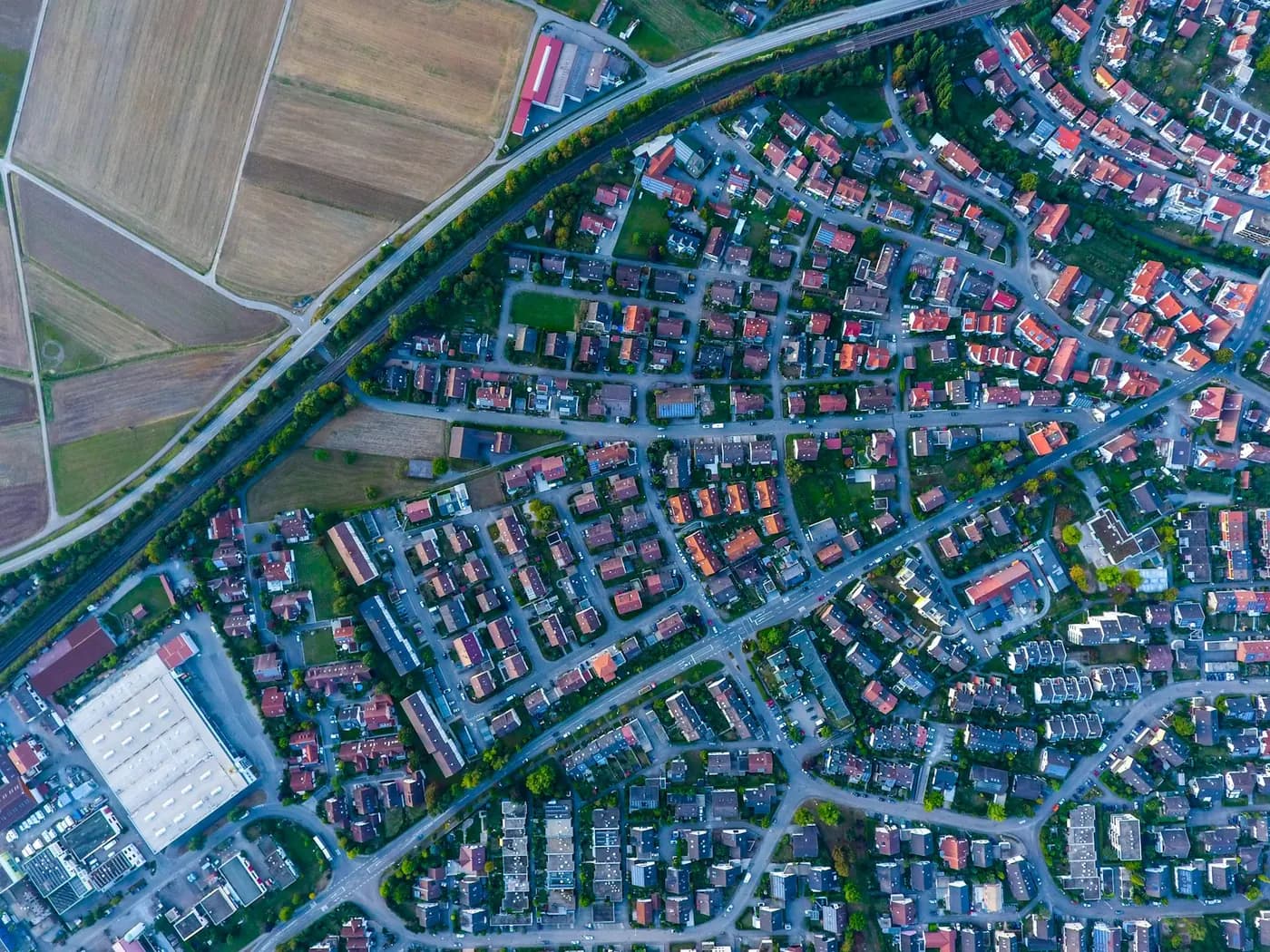 Overhead view of a suburban grid of houses and streets