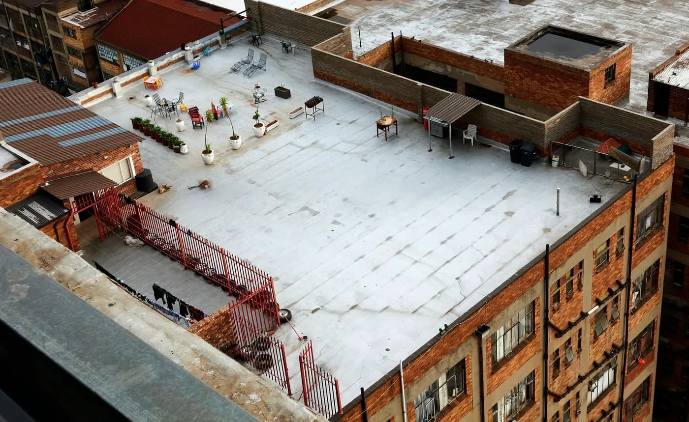 Flat roof of a brick warehouse building, seen from above
