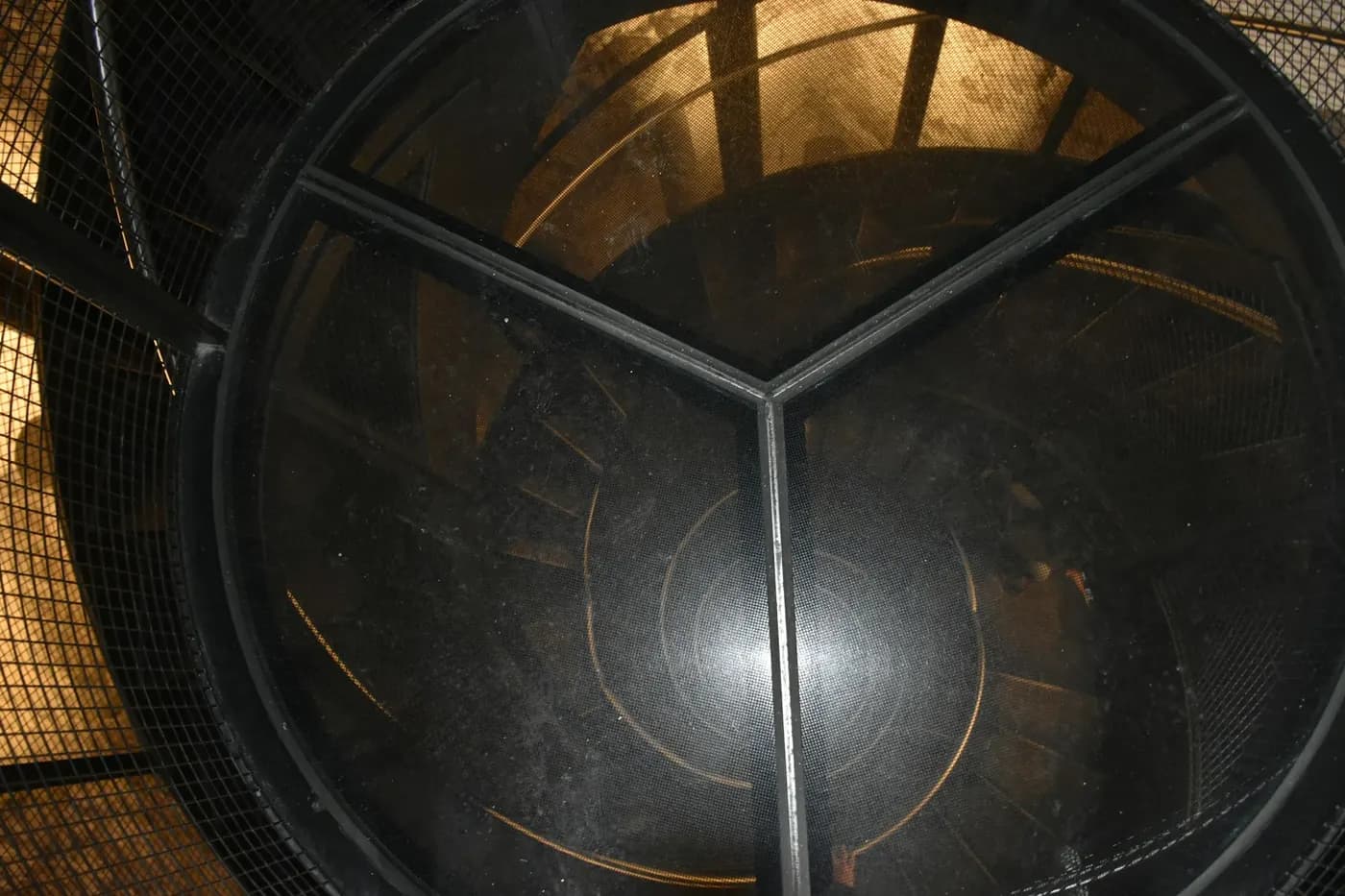 Inside a large round vessel with steel bracing