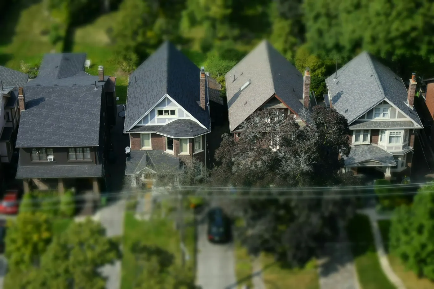 Overhead view of a row of houses with steep gabled roofs
